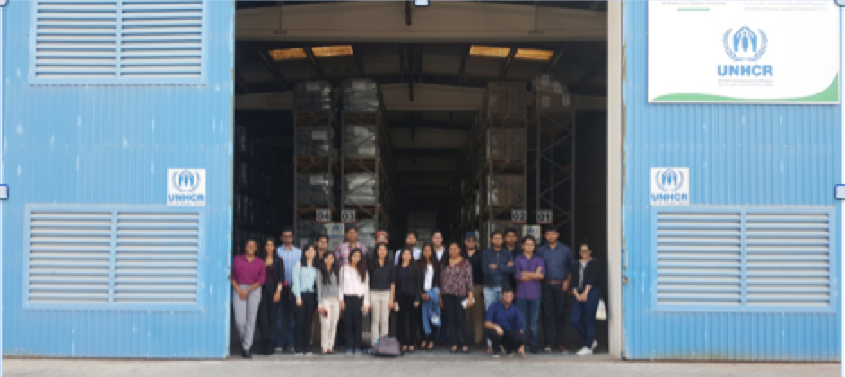 S P Jain BBA15 students are dwarfed by the immensity of UNHCR's relief supply warehouse