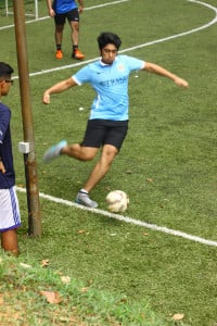 Student dribbling the ball